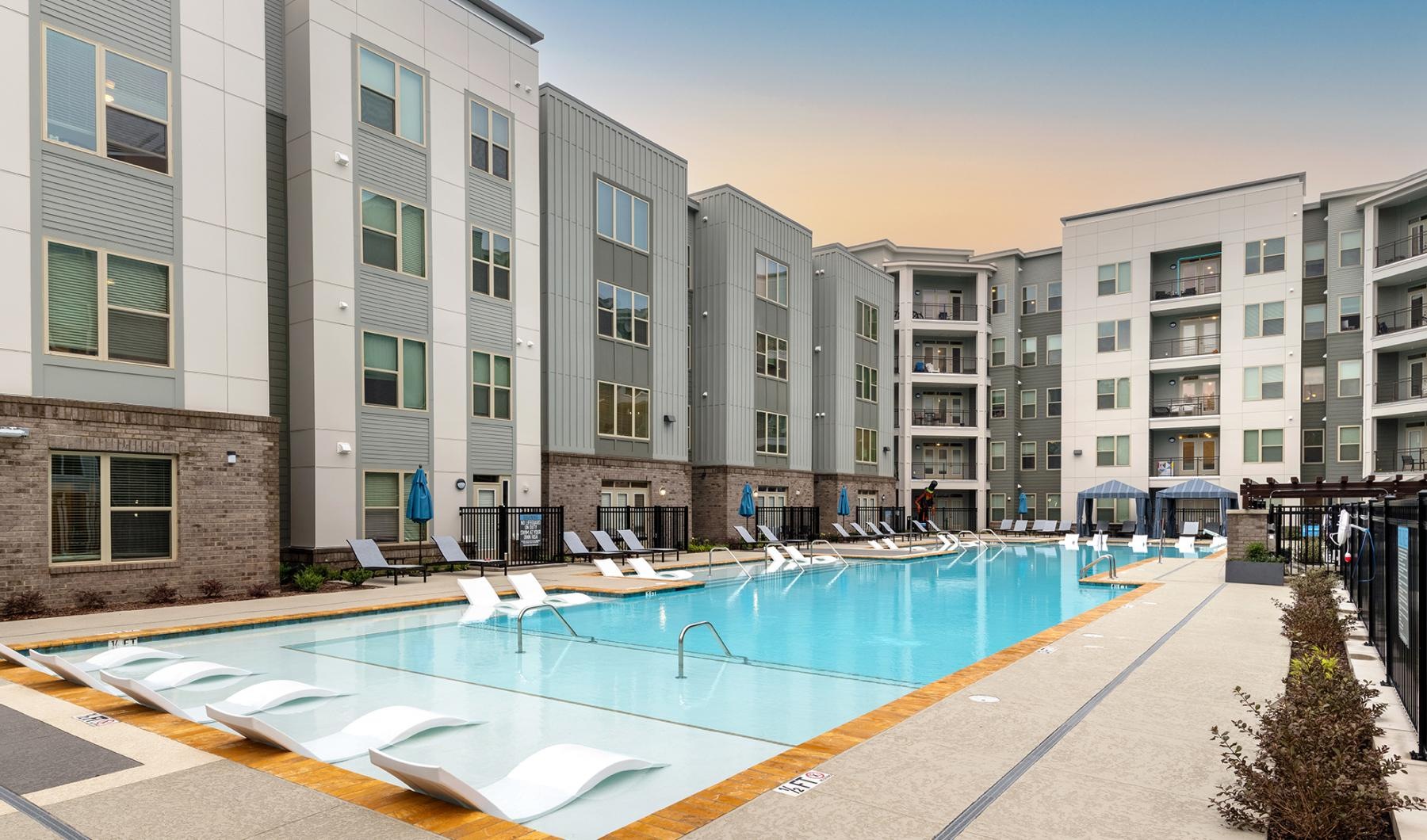 a swimming pool in front of a building