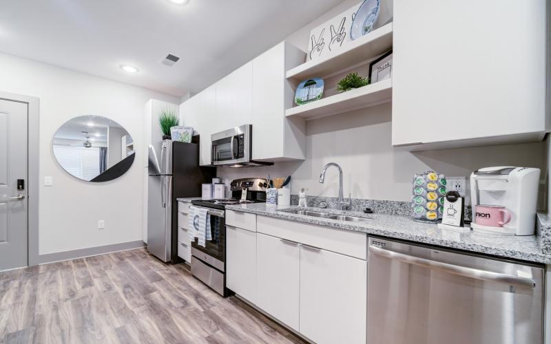 a kitchen with white cabinets
