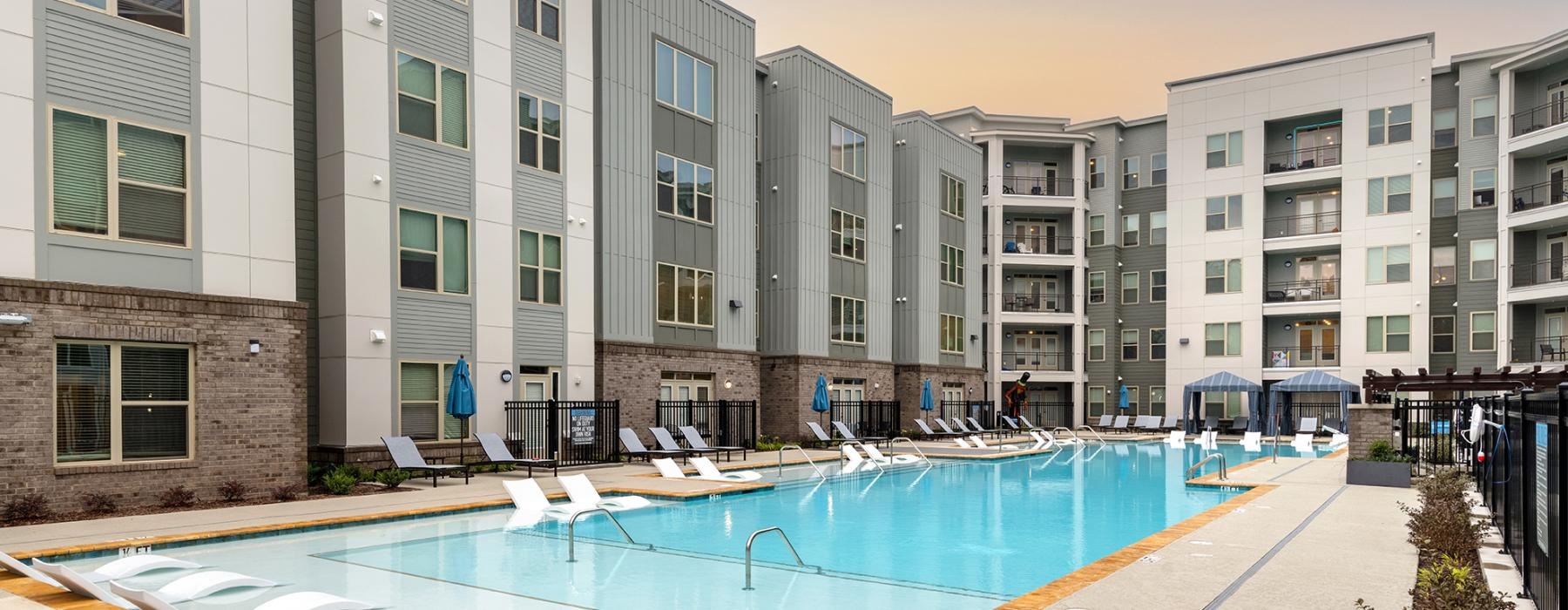 a swimming pool in front of a building
